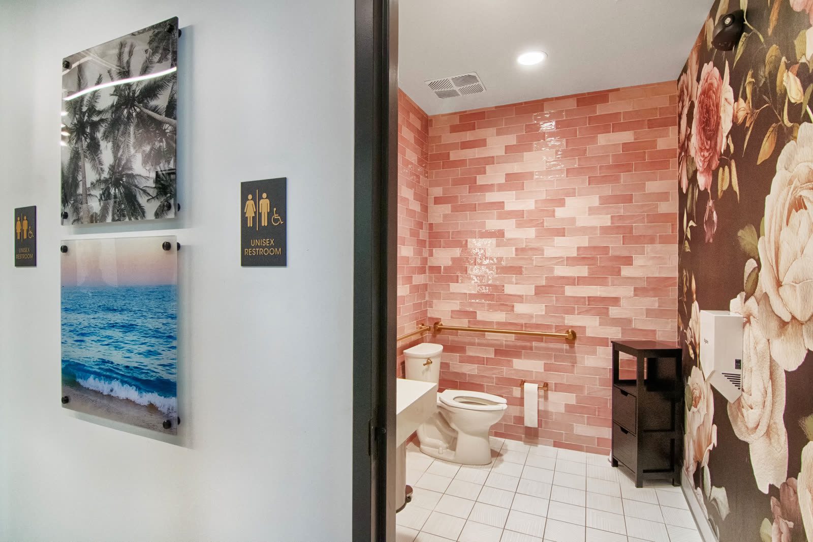 Elegant bathroom with ocean-themed artwork