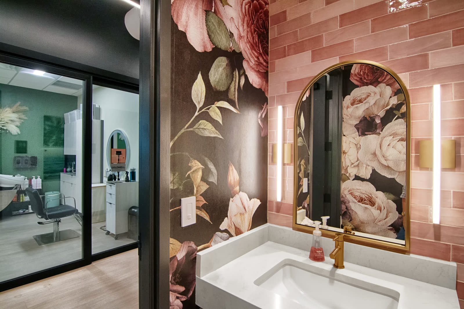 Stylish bathroom featuring floral decor and lighting