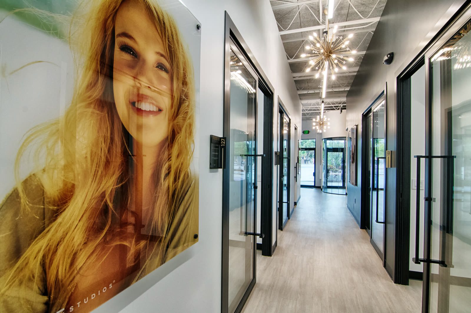 Bright corridor featuring large portrait