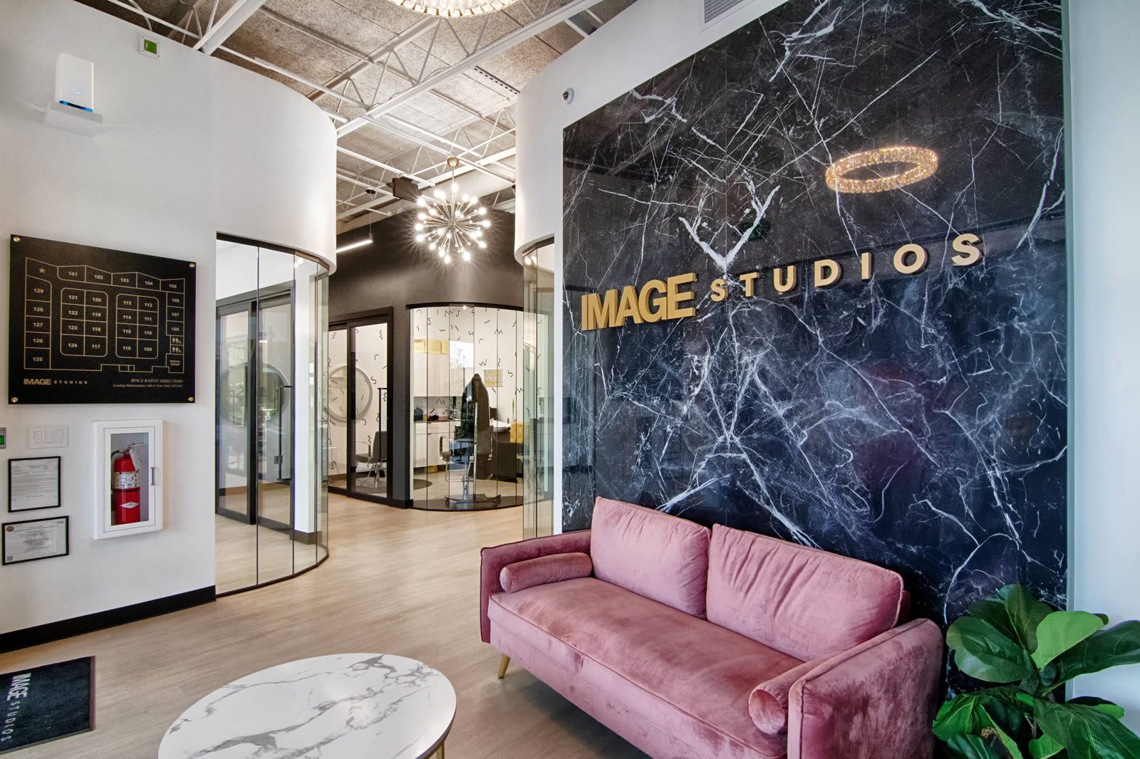 Modern studio lobby with pink sofa